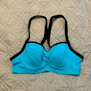 VSX sports bra. Turquoise and black. 3hook eyes. Size 36B.